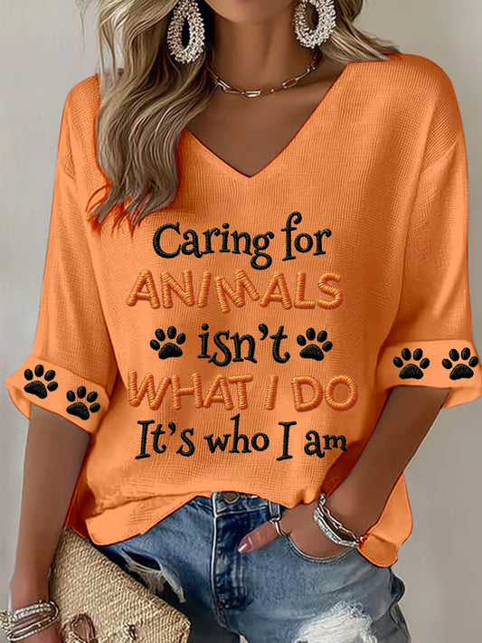 Women's "Caring for animals isn't what I do, it's who I am" V-neck Tops